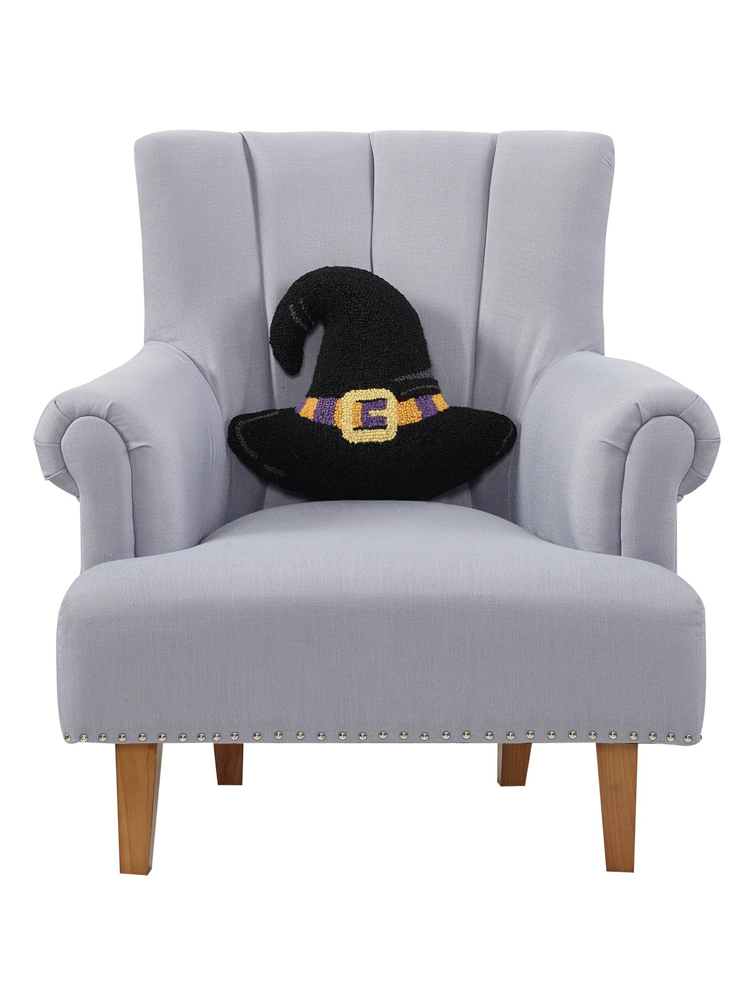Shaped Witch Hat Hooked Wool Halloween Throw Pillow on an armchair, showing the throw pillow at room scale, 14x16 inch