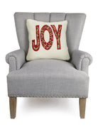 Sherpa Joy Embroidered Christmas Throw Pillow on an armchair, showing the throw pillow at room scale, 16x16 inch