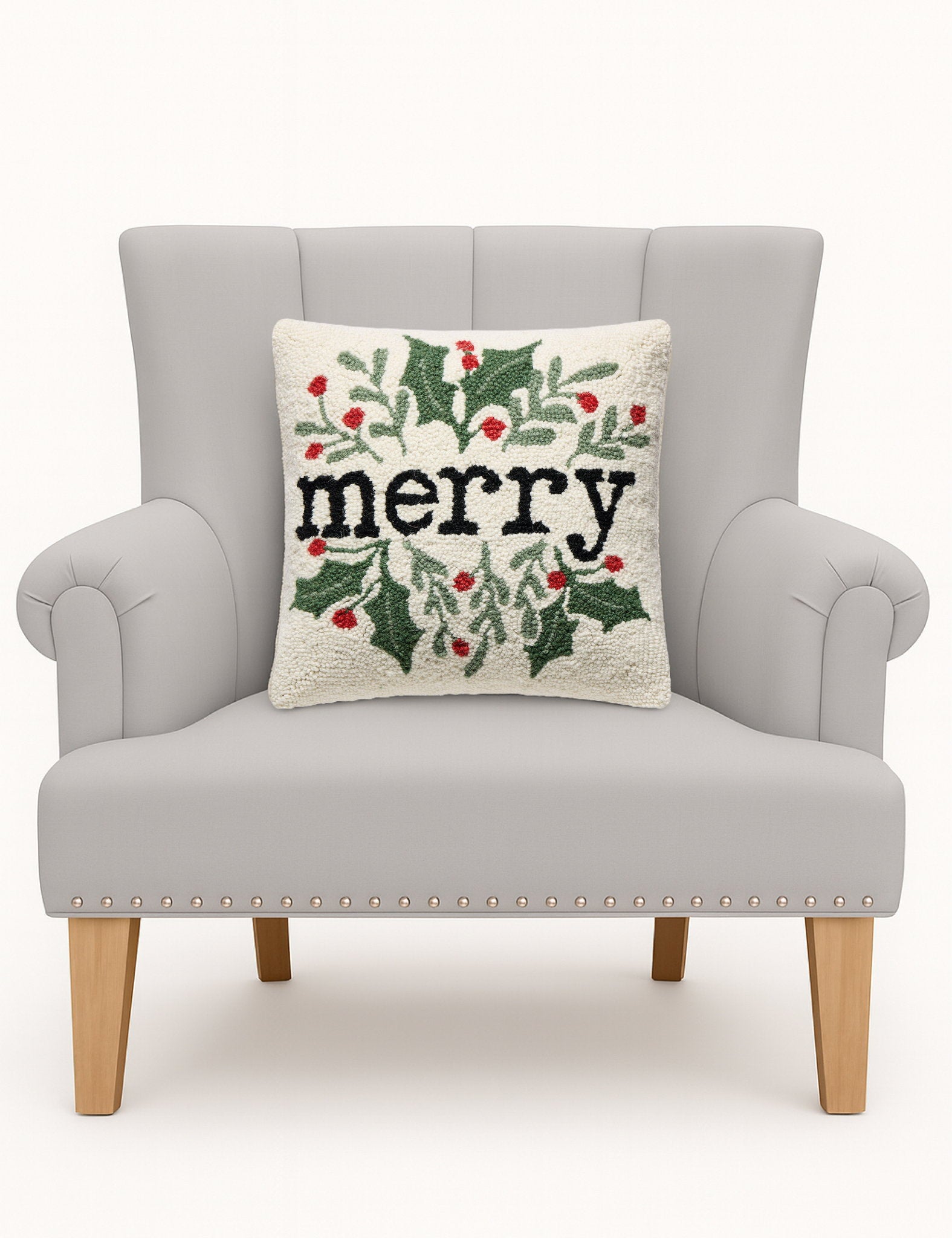 Simple Merry Foliage Hooked Wool Christmas Throw Pillow on an armchair, showing the throw pillow at room scale, 16x16 inch