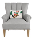 Sledding Kids Hooked Wool Christmas Throw Pillow on an armchair, showing the throw pillow at room scale, 8x12 inch