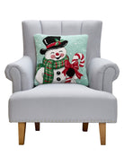Smiling Snowman Hooked Wool Christmas Throw Pillow on an armchair, showing the throw pillow at room scale, 18x18 inch