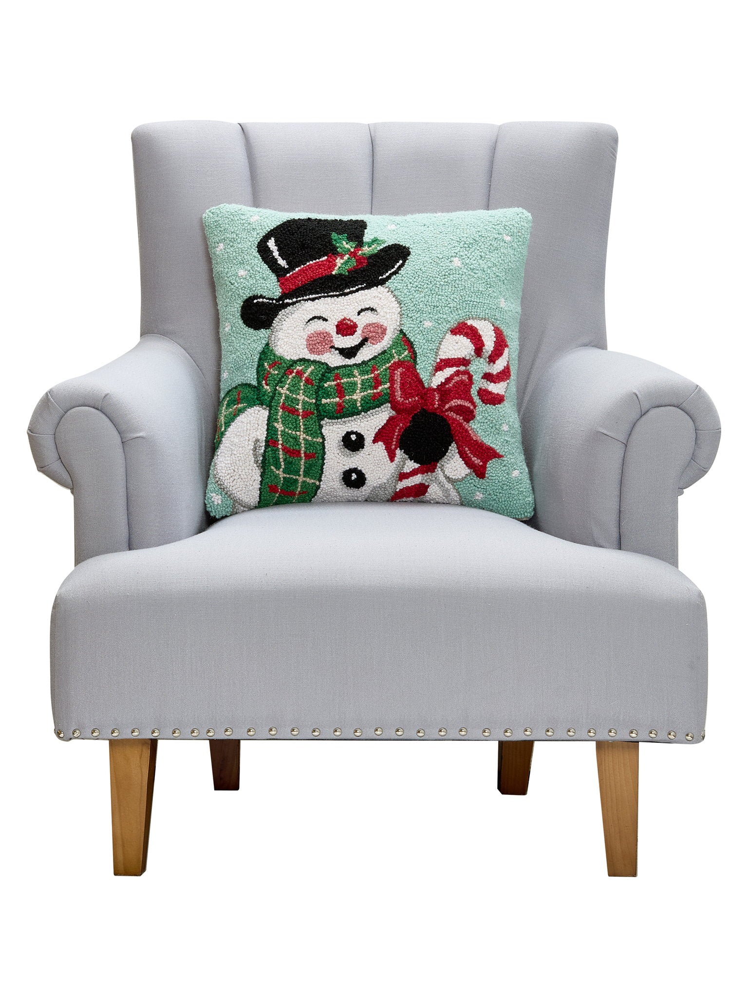 Smiling Snowman Hooked Wool Christmas Throw Pillow on an armchair, showing the throw pillow at room scale, 18x18 inch
