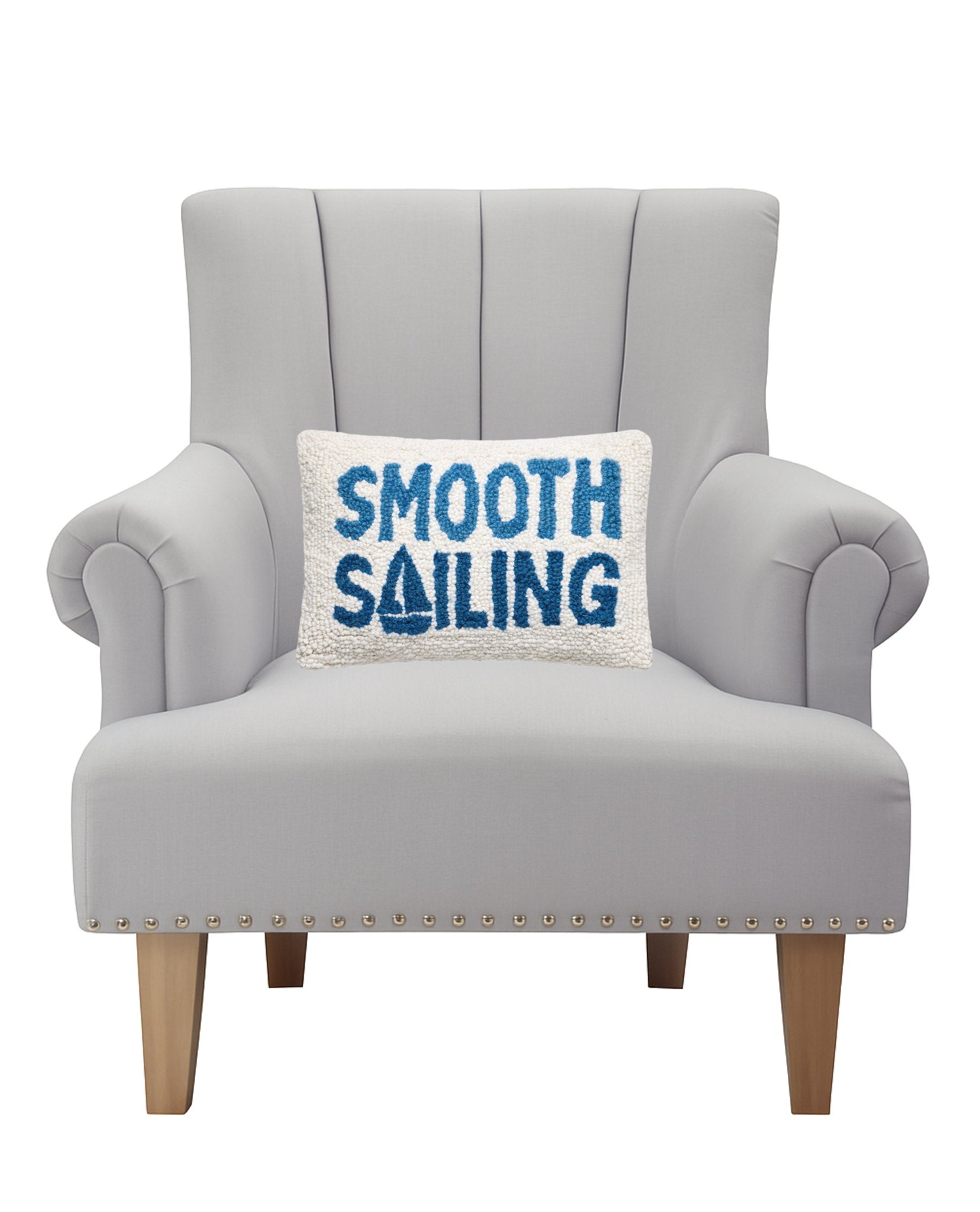 Smooth Sailing Hooked Wool Throw Pillow on an armchair, showing the throw pillow at room scale, 8x12 inch