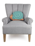 Snail Shaped Hooked Wool Throw Pillow on an armchair, showing the throw pillow at room scale, 12x16 inch