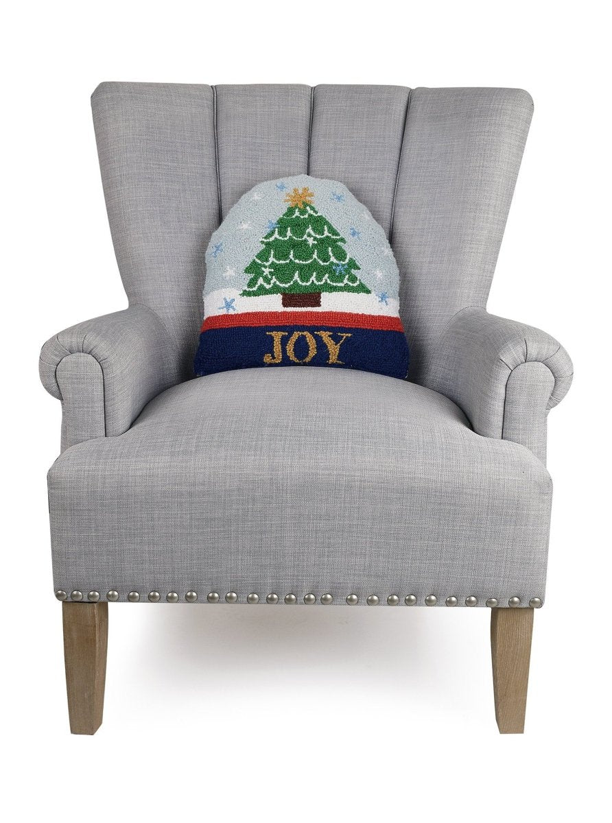 Snow Globe Shaped Hooked Wool Christmas Throw Pillow on an armchair, showing the throw pillow at room scale, 14x14 inch