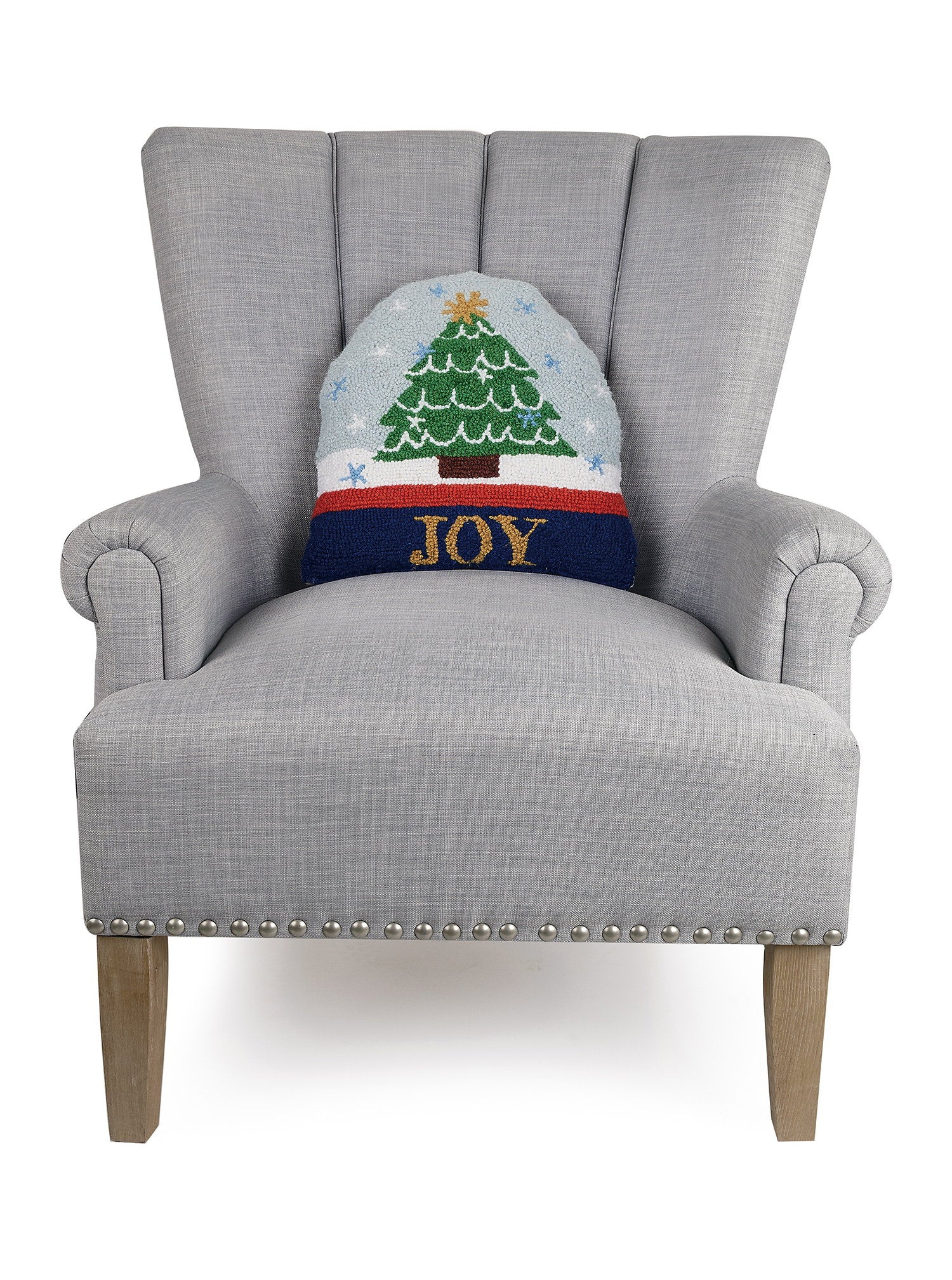Snow Globe Shaped Hooked Wool Christmas Throw Pillow on an armchair, showing the throw pillow at room scale, 14x14 inch