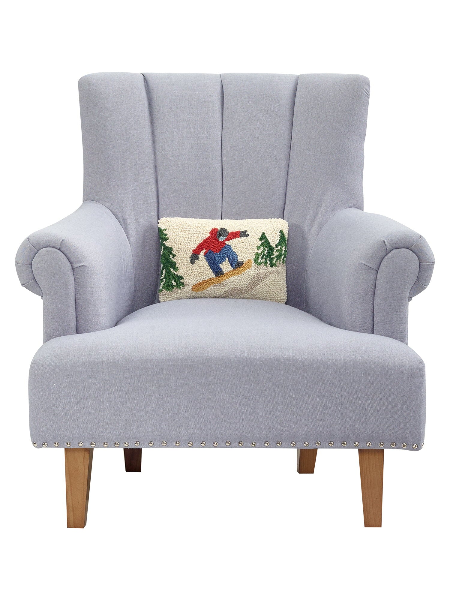 Snowboarder Hooked Wool Christmas Throw Pillow on an armchair, showing the throw pillow at room scale, 8x12 inch