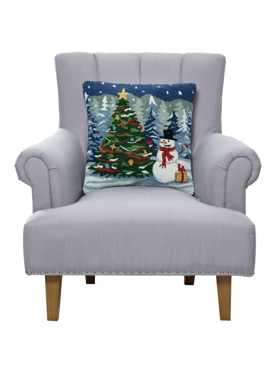 Snowy Tree with Snowman Hooked Wool Christmas Throw Pillow on an armchair, showing the throw pillow at room scale, 18x18 inch