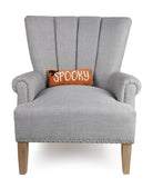 Spooky Hooked Wool Halloween Throw Pillow on an armchair, showing the throw pillow at room scale, 12x5 inch