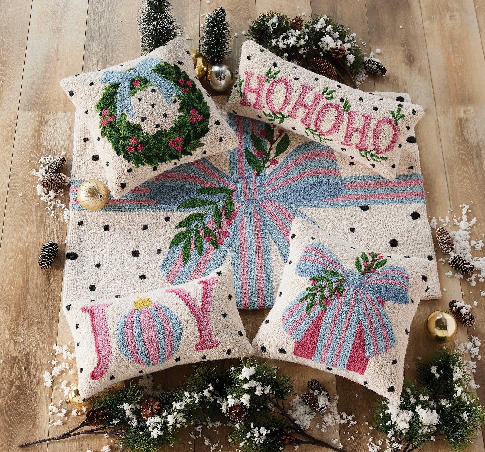 Spotted Holiday Ho Ho Ho Hooked Wool Christmas Throw Pillow shown alongside other designs in the same collection, 8x20 inch