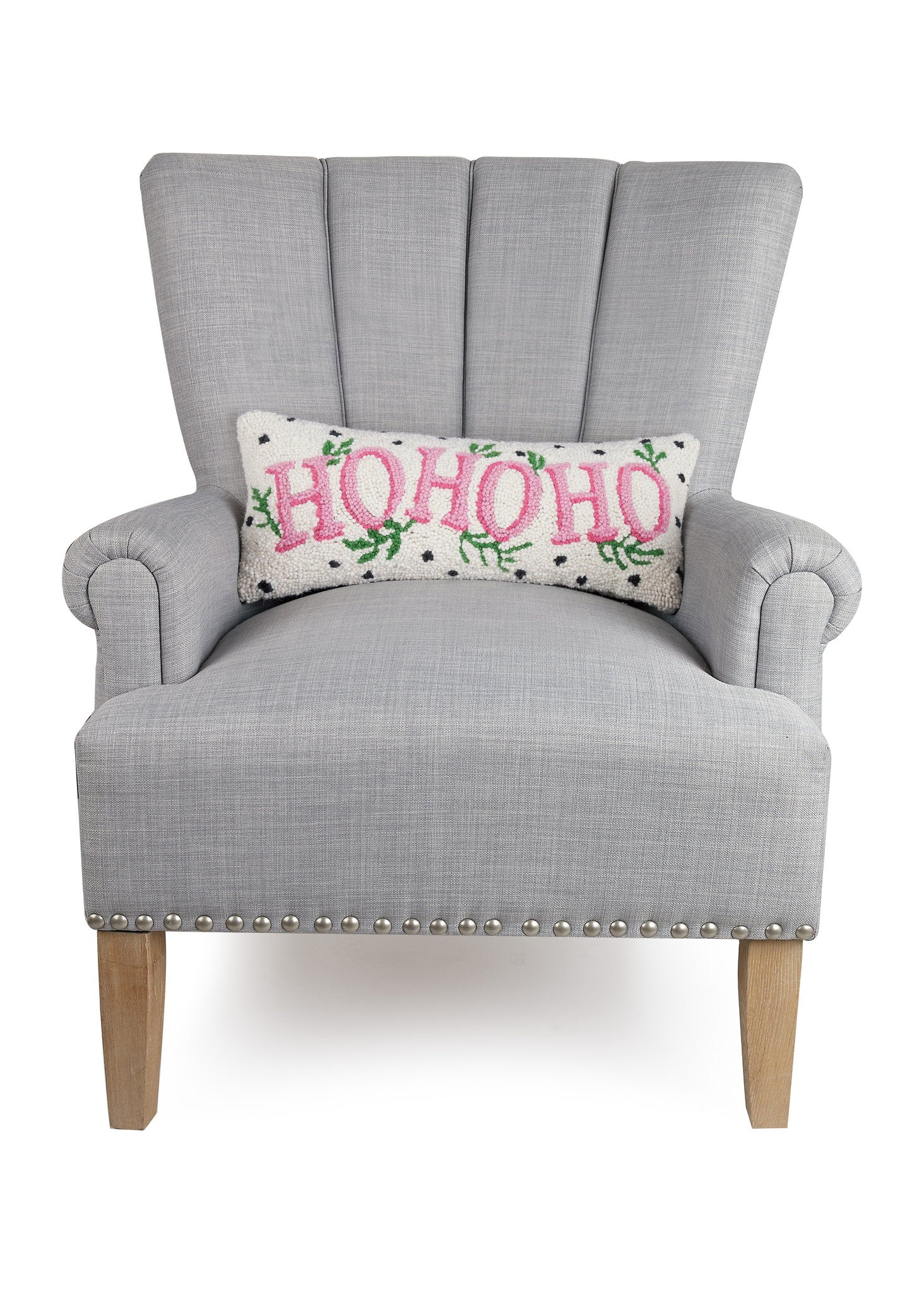 Spotted Holiday Ho Ho Ho Hooked Wool Christmas Throw Pillow on an armchair, showing the throw pillow at room scale, 8x20 inch