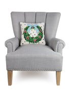 Spotted Holiday Wreath Hooked Wool Christmas Throw Pillow on an armchair, showing the throw pillow at room scale, 14x14 inch