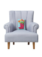 Spring Boot Tulips Hooked Wool Throw Pillow on an armchair, showing the throw pillow at room scale, 8x12 inch
