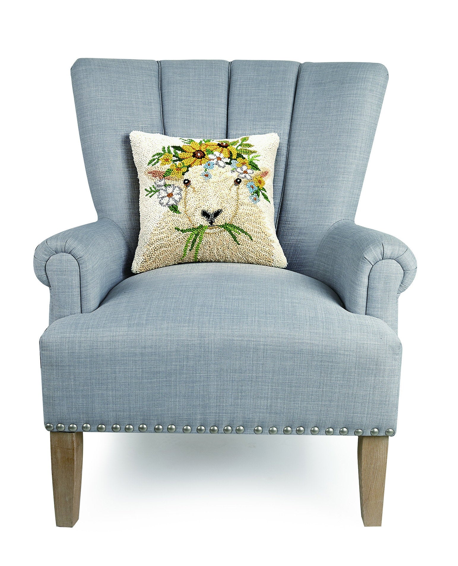 Spring Sheep Hooked Wool Throw Pillow on an armchair, showing the throw pillow at room scale, 14x14 inch