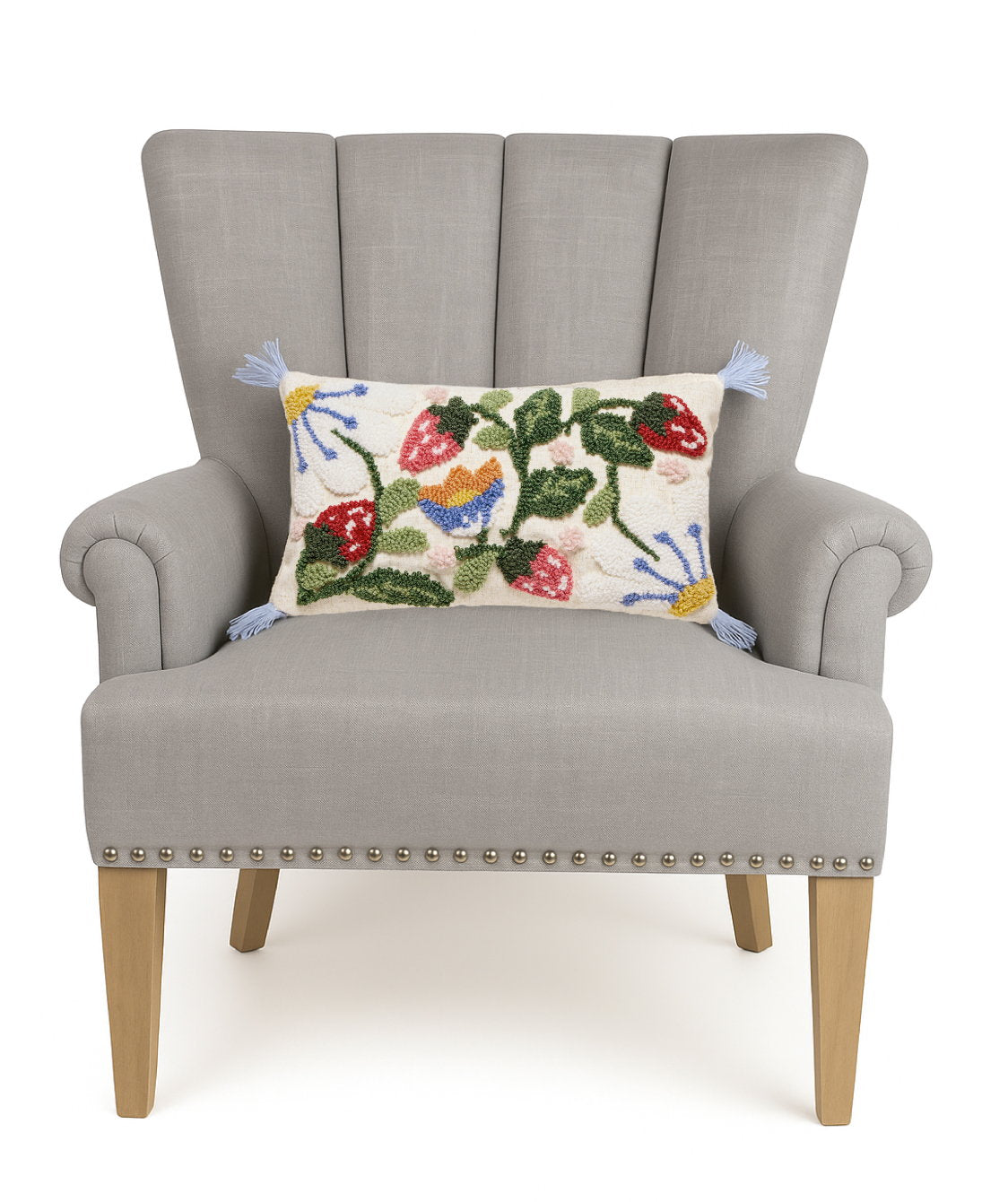 Strawberry Garden Tufted Hooked Wool Throw Pillow on an armchair, showing the throw pillow at room scale, 9x16 inch