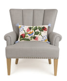 Strawberry Garden Tufted Hooked Wool Throw Pillow on an armchair, showing the throw pillow at room scale, 9x16 inch
