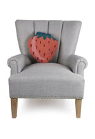 Strawberry Tassel Shaped Hooked Wool Throw Pillow on an armchair, showing the throw pillow at room scale, 14x14 inch