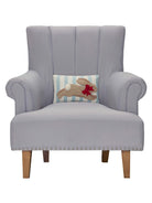 Stripe Bunny Hooked Easter Throw Pillow on an armchair, showing the throw pillow at room scale, 8x12 inch
