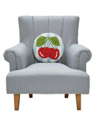 Stripe Cherries Hooked Wool Throw Pillow on an armchair, showing the throw pillow at room scale, 14x14 inch