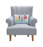 Stripe Floral Oblong Embroidered Throw Pillow on an armchair, showing the throw pillow at room scale, 12x18 inch