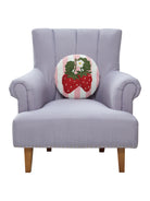 Stripe Strawberries Hooked Wool Throw Pillow on an armchair, showing the throw pillow at room scale, 14x14 inch