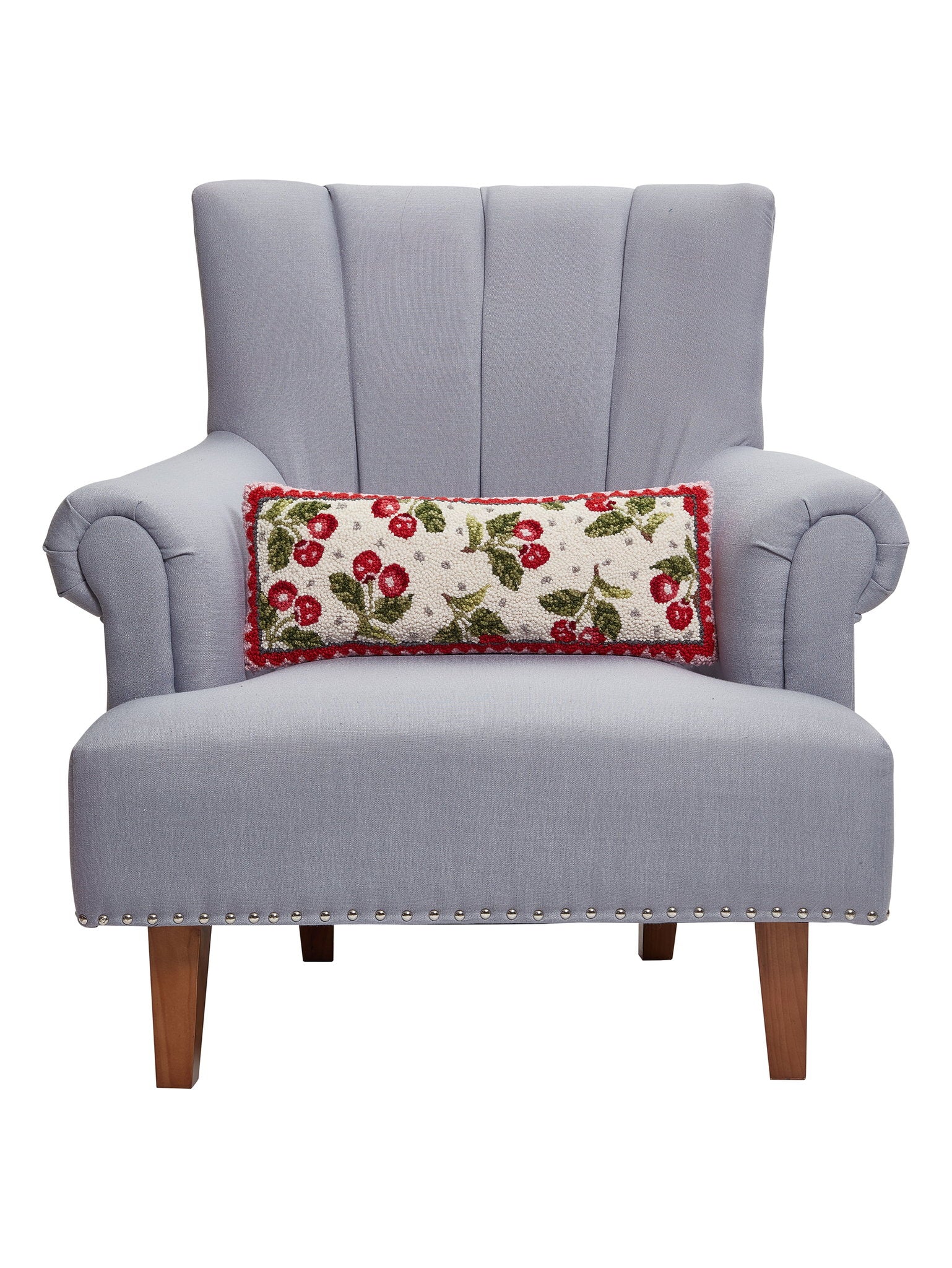 Sweet Cherry Hooked Wool Throw Pillow on an armchair, showing the throw pillow at room scale, 8x20 inch