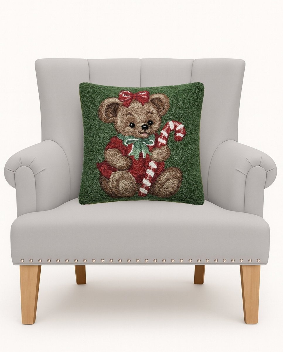 Teddy Bear Hooked Wool Christmas Throw Pillow on an armchair, showing the throw pillow at room scale, 16x16 inch