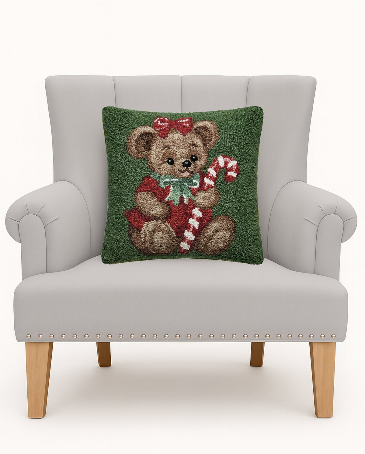 Teddy Bear Hooked Wool Christmas Throw Pillow on an armchair, showing the throw pillow at room scale, 16x16 inch