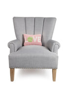Tennis Love Hooked Wool Throw Pillow on an armchair, showing the throw pillow at room scale, 8x12 inch