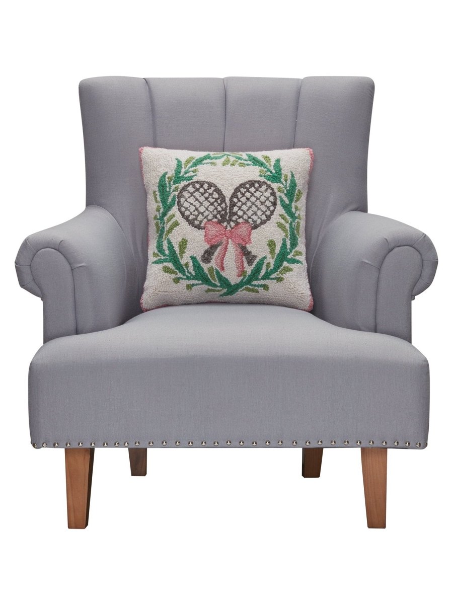 Tennis with Wreath Hooked Wool Throw Pillow on an armchair, showing the throw pillow at room scale, 16x16 inch
