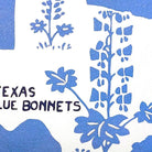 Hand-stitched wool detail of Texas Blue Bonnet State Travel needlepoint pillow showing intricate weave pattern and texture