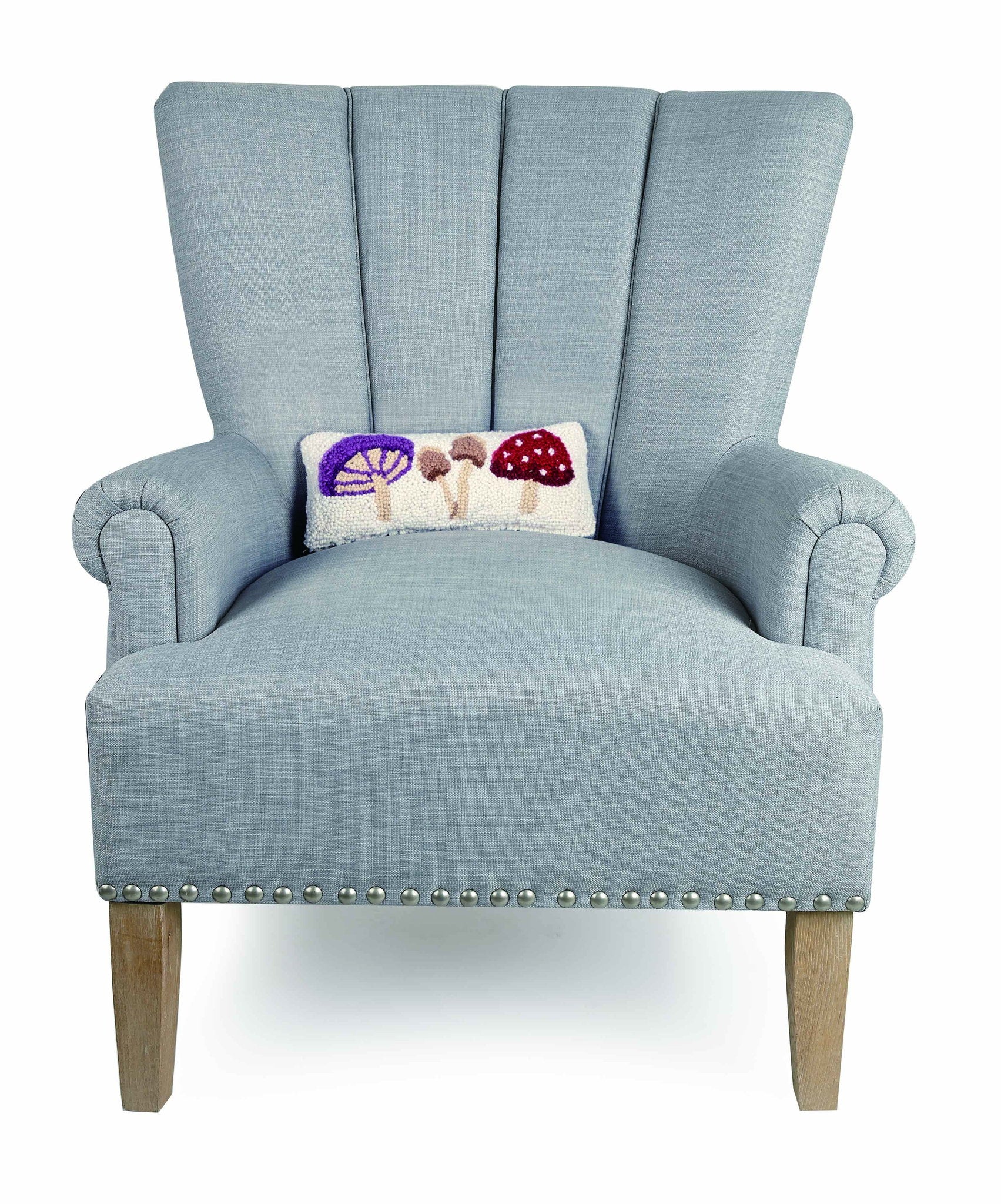 Toadstool Trio Mushrooms Hooked Wool Throw Pillow on an armchair, showing the throw pillow at room scale, 12x5 inch