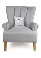 Tooth Fairy Embroidered Throw Pillow on an armchair, showing the throw pillow at room scale, 10x10 inch