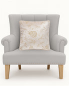 Tossed Foliage Champagne Velvet Embroidered Christmas Throw Pillow on an armchair, showing the throw pillow at room scale, 16x16 inch