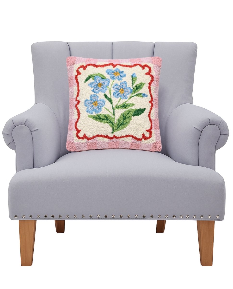 Touch-Me-Not Frame Hooked Wool Throw Pillow on an armchair, showing the throw pillow at room scale, 14x14 inch
