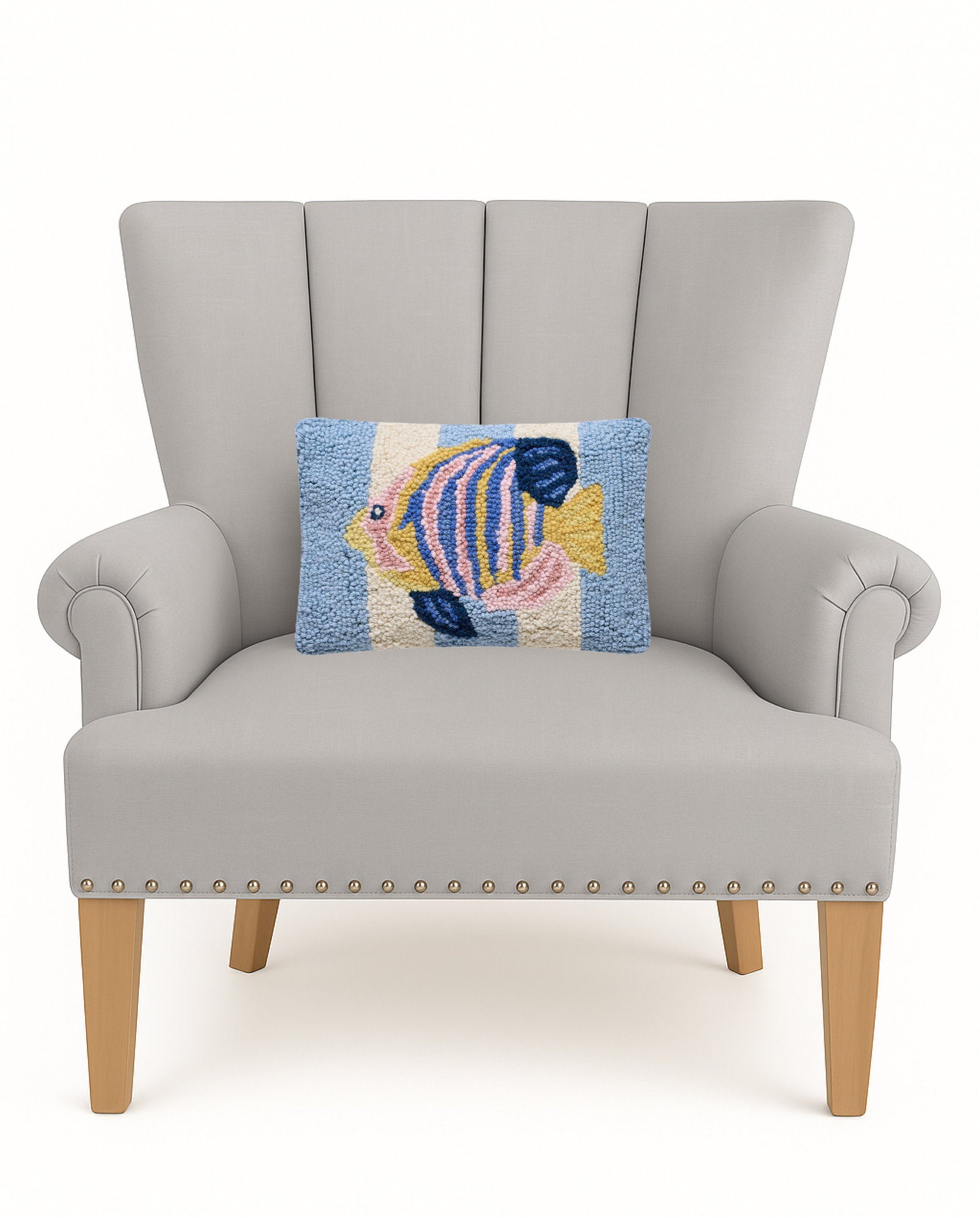 Tropical Fish Hooked Wool Throw Pillow on an armchair, showing the throw pillow at room scale, 8x12 inch