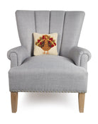 Turkey Hooked Wool Fall Harvest Throw Pillow on an armchair, showing the throw pillow at room scale, 10x10 inch