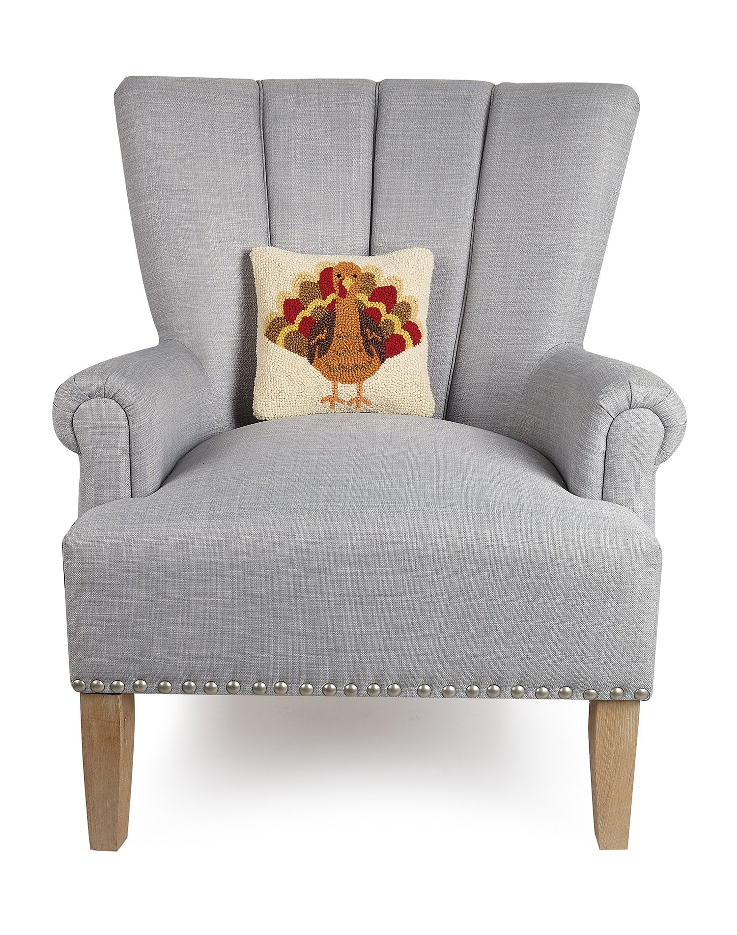 Turkey Hooked Wool Fall Harvest Throw Pillow on an armchair, showing the throw pillow at room scale, 10x10 inch