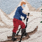 Uphill Skier Hooked Wool Christmas Throw Pillow, close-up detail