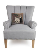 Vase and Plant Hooked Wool Throw Pillow on an armchair, showing the throw pillow at room scale, 12x12 inch