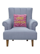 Vibe Check Hooked Wool Throw Pillow on an armchair, showing the throw pillow at room scale, 14x14 inch