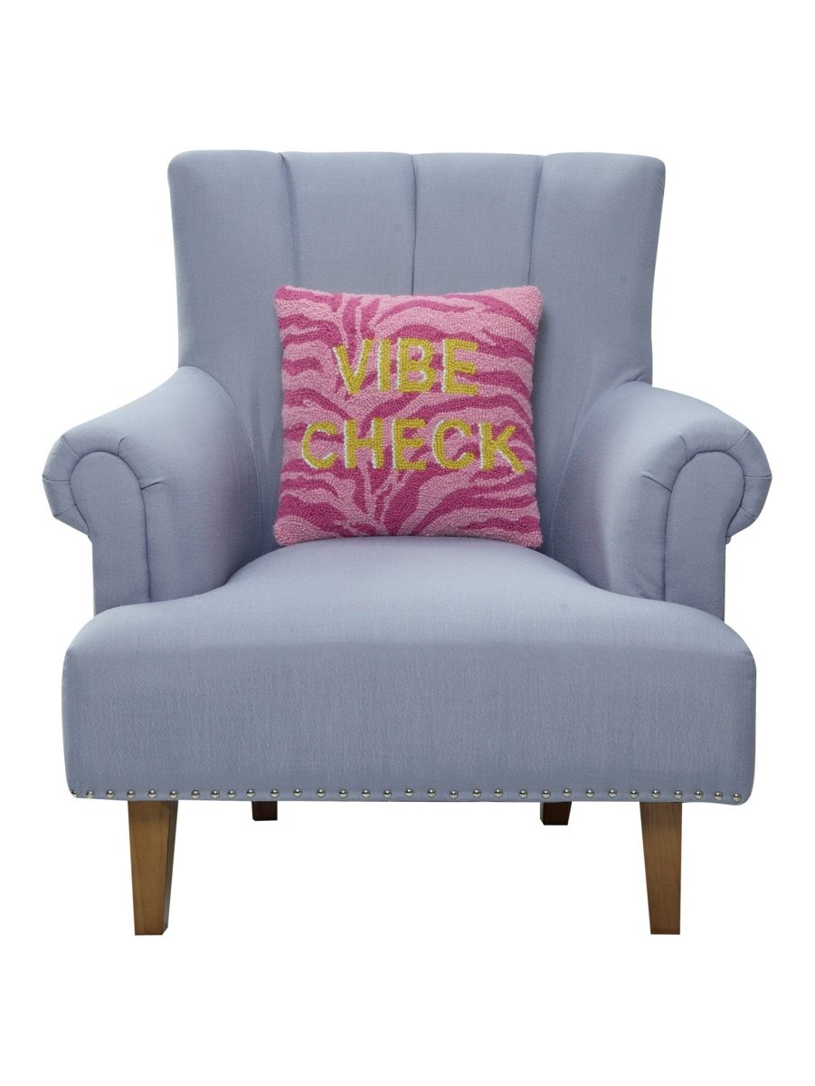 Vibe Check Hooked Wool Throw Pillow on an armchair, showing the throw pillow at room scale, 14x14 inch
