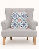 Vintage Floral Tile Hooked Wool Throw Pillow on an armchair, showing the throw pillow at room scale, 16x16 inch