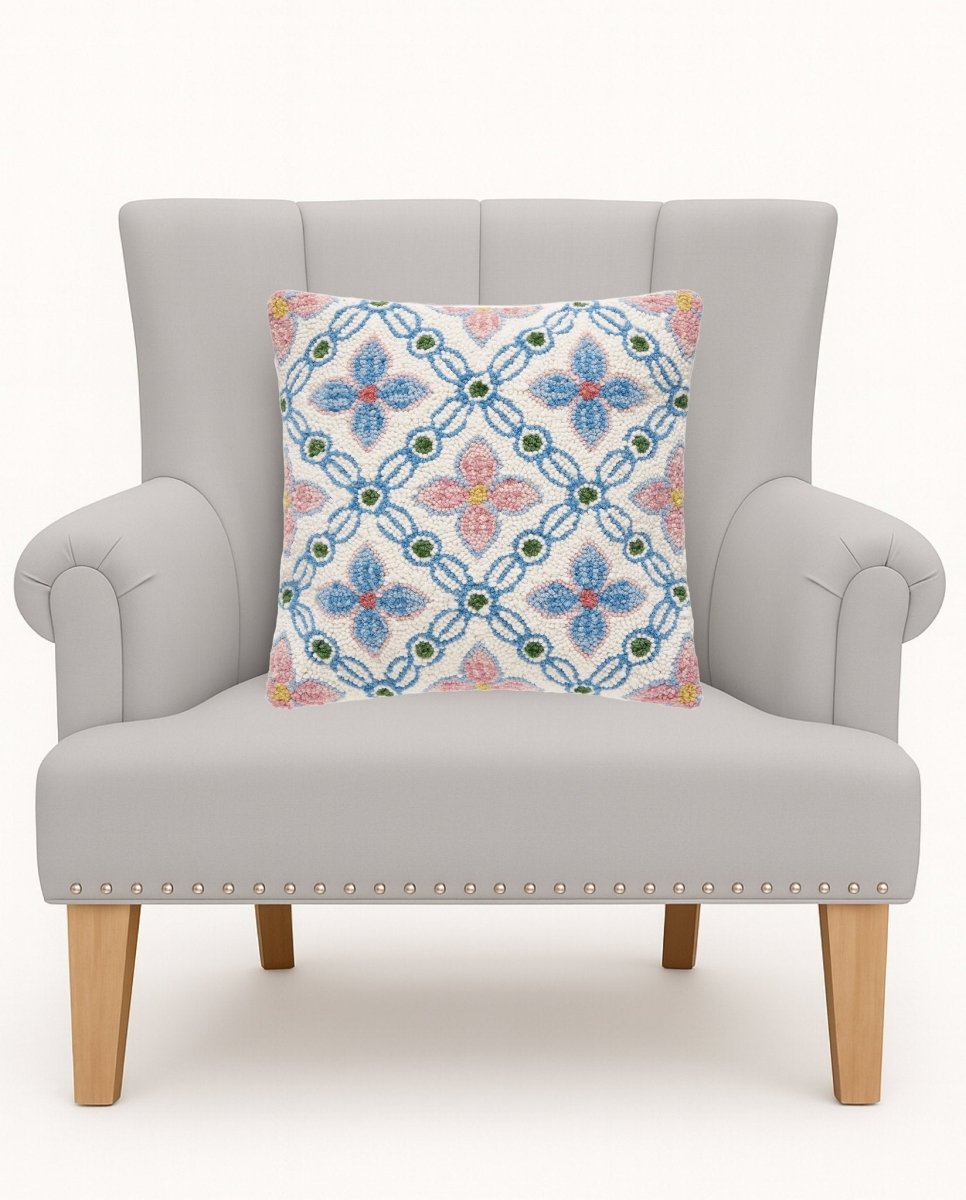 Vintage Floral Tile Hooked Wool Throw Pillow on an armchair, showing the throw pillow at room scale, 16x16 inch
