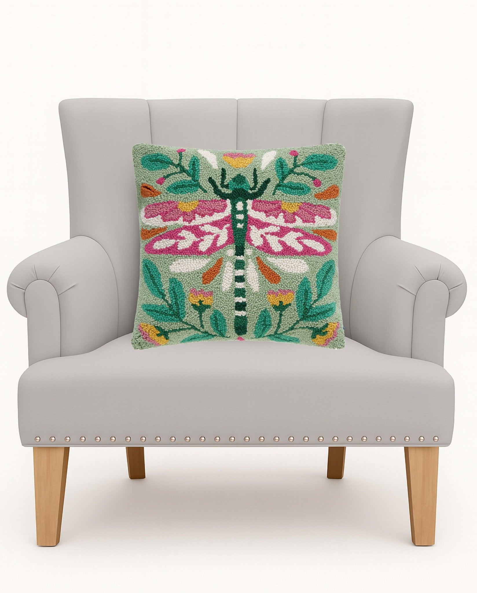 Vintage Floral Tile Lumber Hooked Wool Throw Pillow on an armchair, showing the throw pillow at room scale, 9x16 inch