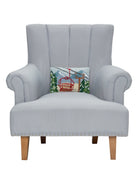 Vintage Gondola Hooked Wool Christmas Throw Pillow on an armchair, showing the throw pillow at room scale, 8x12 inch