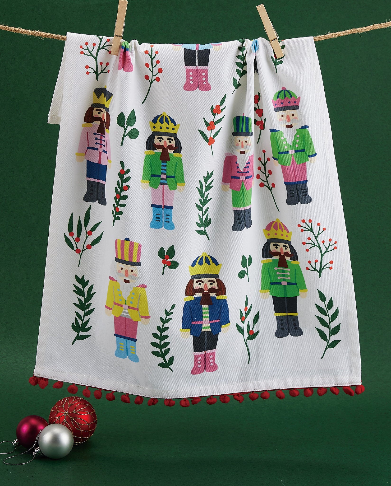 Vintage Nutcrackers with Pom Pom Printed Christmas Kitchen Towel styled in a room setting, 18x25 inch