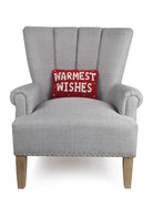 Warmest Wishes Hooked Wool Christmas Throw Pillow on an armchair, showing the throw pillow at room scale, 8x12 inch