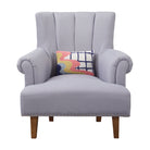 Wave Check Hooked Wool Throw Pillow on an armchair, showing the throw pillow at room scale, 8x12 inch