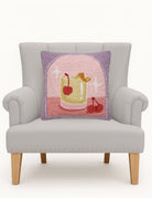 Whiskey Sour Hooked Wool Throw Pillow on an armchair, showing the throw pillow at room scale, 16x16 inch